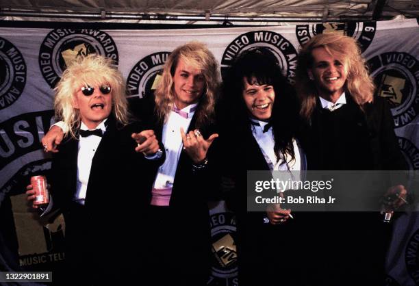 Members of Poison: C.C. Deville, Brett Michaels, Bobby Dall and Rikki Rockett backstage at the Mtv Awards Show, September 13, 1987 in Los...