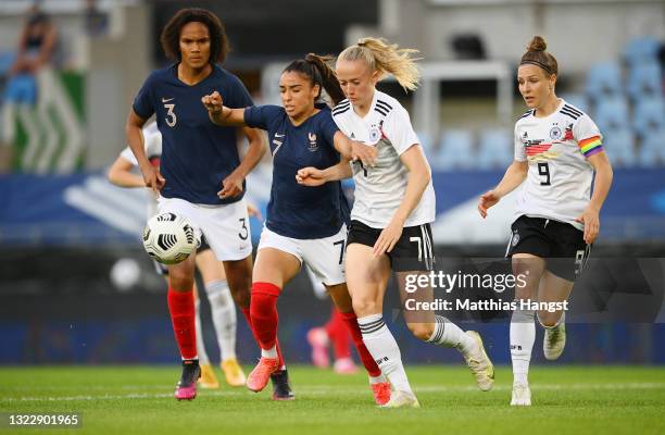 Sakina Karchaoui of France battles for possession with Lea Schuller of Germany during the Women's International Friendly match between France and...