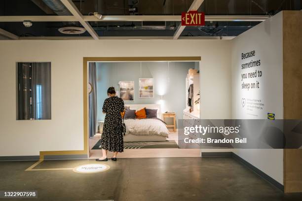Woman checks pricing at an IKEA store on June 10, 2021 in Houston, Texas. The Labor Department reported that this May, consumer prices have...