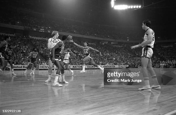 Seattle Supersonics guard Dennis Johnson chases the ball past mid-court during an NBA basketball game against the Denver Nuggets at McNichols Arena...