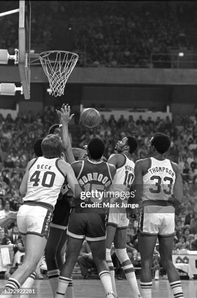 Group of players surrounds the basketball during an NBA game between the Denver Nuggets and the Seattle Supersonics at McNichols Arena on January 21,...