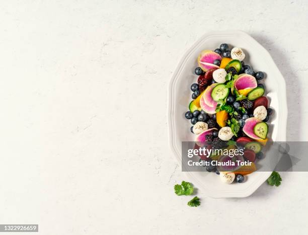 bowl of fresh salad on white background - brambleberry stock pictures, royalty-free photos & images