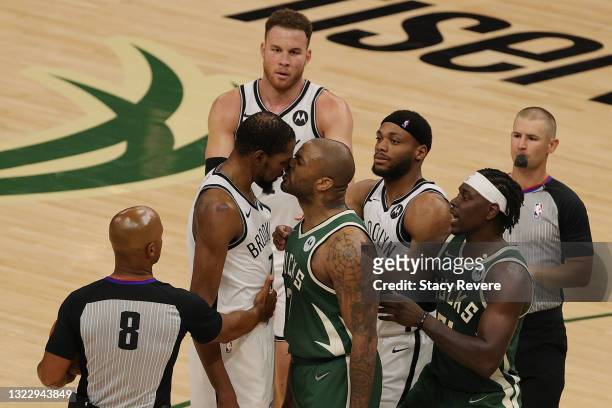 Kevin Durant of the Brooklyn Nets and P.J. Tucker of the Milwaukee Bucks exchange words during the second half of Game Three of the Eastern...