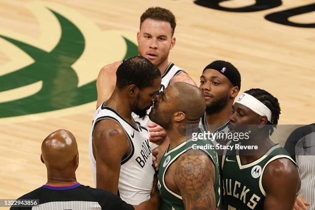 Kevin Durant of the Brooklyn Nets and P.J. Tucker of the Milwaukee Bucks exchange words during the second half of Game Three of the Eastern...