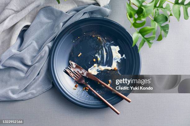 the plate after eating. - dirty plate stock pictures, royalty-free photos & images