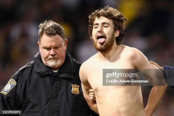 Streaker runs onto the field in the sixth inning of a game against the Houston Astros at Fenway Park on June 10, 2021 in Boston, Massachusetts.