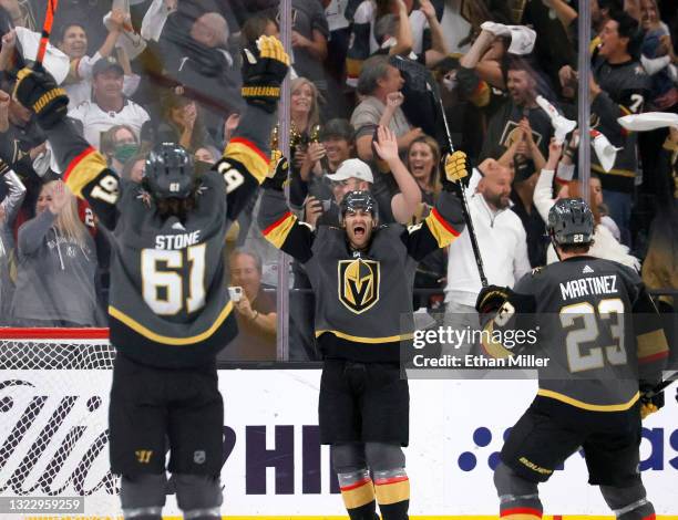 Mark Stone, Max Pacioretty and Alec Martinez of the Vegas Golden Knights celebrate Pacioretty's third-period empty-net goal against the Colorado...