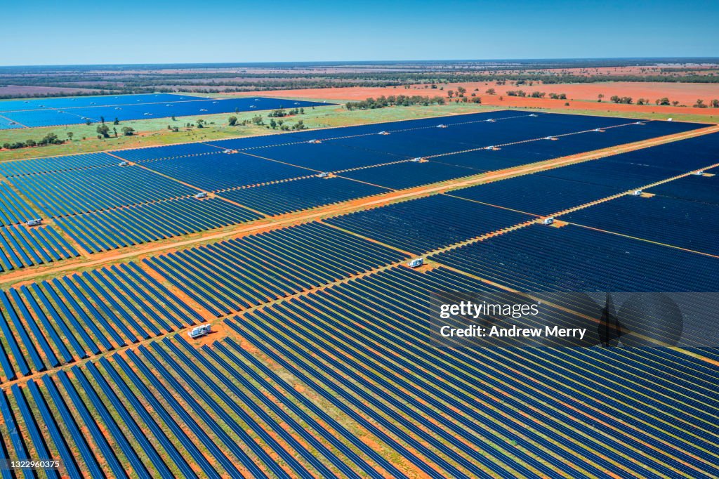 Large solar power station, solar farm, renewable energy plant, aerial view