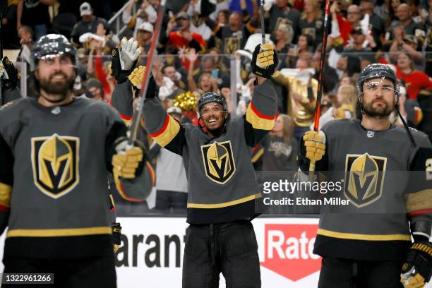 Alex Tuch, Keegan Kolesar and William Carrier of the Vegas Golden Knights celebrate after the team's 6-3 victory over the Colorado Avalanche to win...