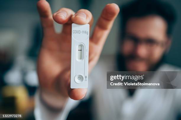 negative test result by using rapid test device for covid-19. - speed test stock pictures, royalty-free photos & images