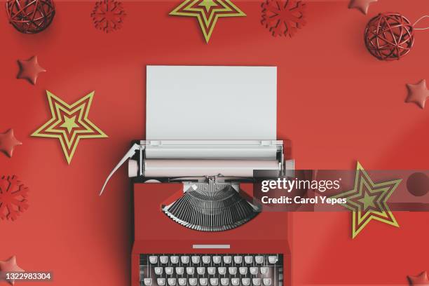 op view of a typewriter from the 70s with blank paper for text, wth christmas decoration - table font view stock pictures, royalty-free photos & images
