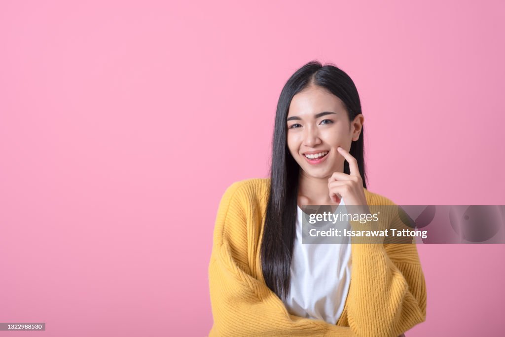 Portrait of dream dreamy nice pretty cute lady youth people touch chin thought choose decide solve problems dilemmas wear fashionable outfit isolated pink background