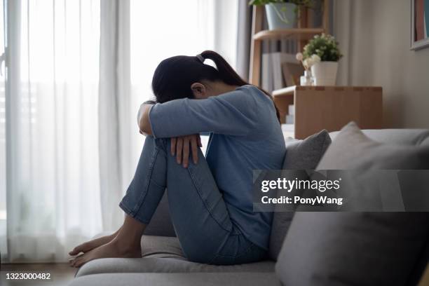 asian depression sad young woman - bipolar disorder stock pictures, royalty-free photos & images
