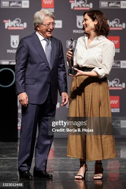 Enrique Cerezo and Madrid president, Isabel Diaz Ayuso receive an honorific award during the presentation of Platino Awards 2021 on June 11, 2021 in...