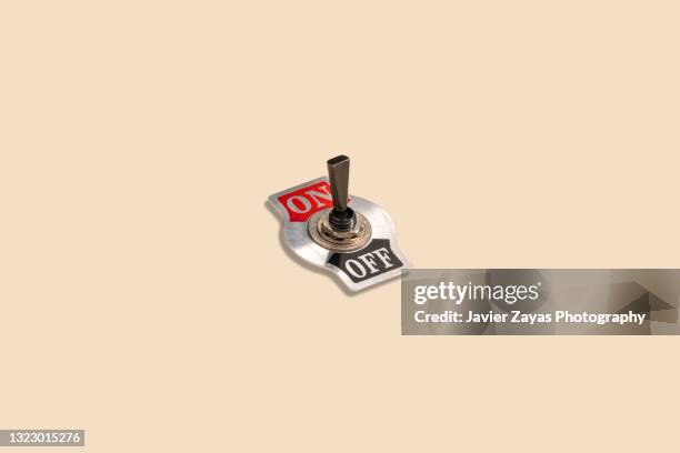 toggle switch on a pastel background - hefboom stockfoto's en -beelden