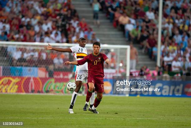 Cristiano Ronaldo of Portugal and Loco of Angola in action during the FIFA World Cup Group D match between Portugal and Angola at the Rhein Energie...