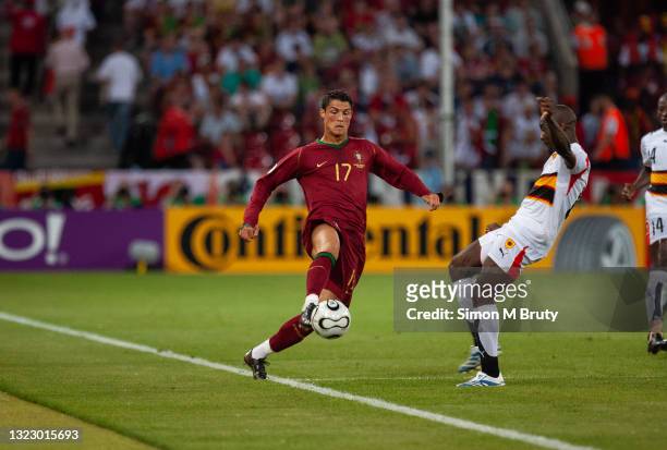 Cristiano Ronaldo of Portugal and Andre of Angola in action during the FIFA World Cup Group D match between Portugal and Angola at the Rhein Energie...