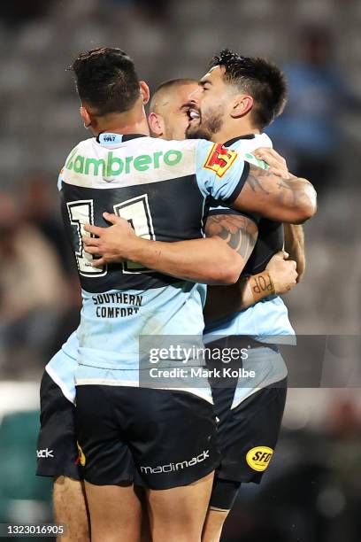 Shaun Johnson of the Sharks celebrates wirth his team mates after kicking a late field goal during the round 14 NRL match between the Cronulla Sharks...