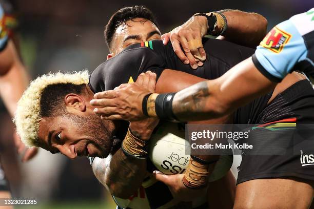 Viliame Kikau of the Panthers is tackled during the round 14 NRL match between the Cronulla Sharks and the Penrith Panthers at Netstrata Jubilee...