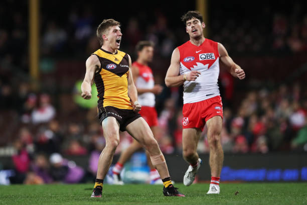 Dylan Moore of the Hawks celebrates a goal during the round 13 AFL match between the Sydney Swans and the Hawthorn Hawks at Sydney Cricket Ground on...
