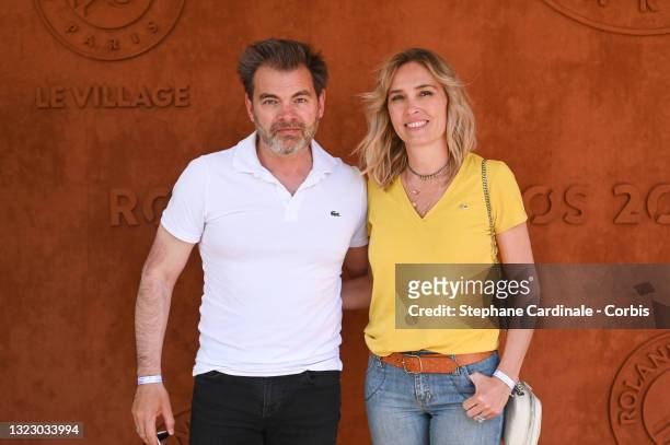 Clovis Cornillac and Lilou Fogli attend the French Open 2021 at Roland Garros on June 11, 2021 in Paris, France.