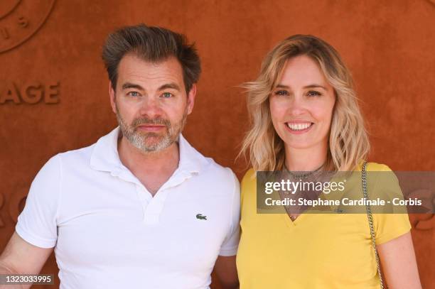 Clovis Cornillac and Lilou Fogli attend the French Open 2021 at Roland Garros on June 11, 2021 in Paris, France.