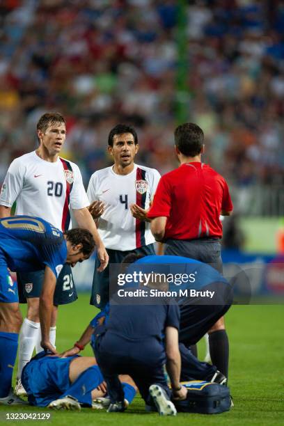 Pablo Mastroeni of the USA argues with Jorge Larrionda of Uruguay the referee after being issued with a red card during the FIFA World Cup Group E...