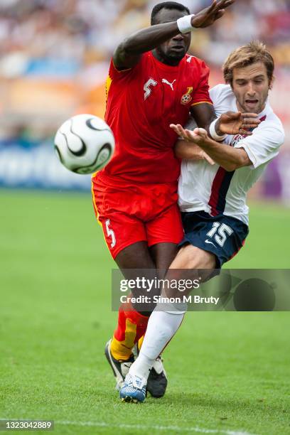 Bobby Convey of the USA and John Mensah of Ghana in action during the FIFA World Cup Group E match between USA and Ghana at the Max-Morlock Stadium...