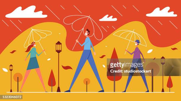 people in rain stand under umbrellas in city park - orange coat stock illustrations