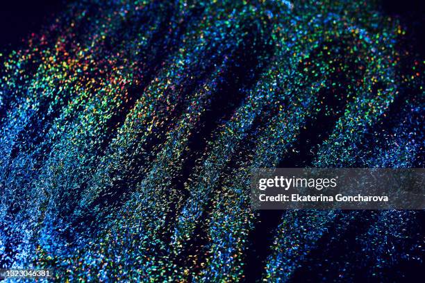 gold sparkling sequins on a black isolated background. - the beat the chic party stock pictures, royalty-free photos & images