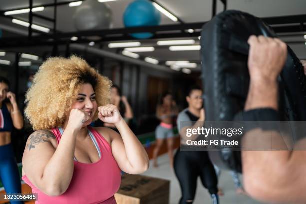 woman on boxing training with fitness instructor - boxing womens stock pictures, royalty-free photos & images