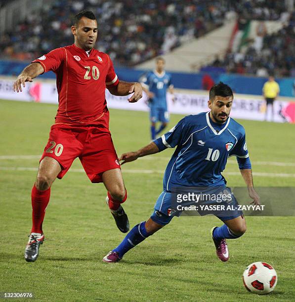 Kuwait's Abdul Aziz al-Meshaan challenges Lebanon's Rida Antar during their 2014 World Cup Asian zone qualifying football match in Kuwait City on...