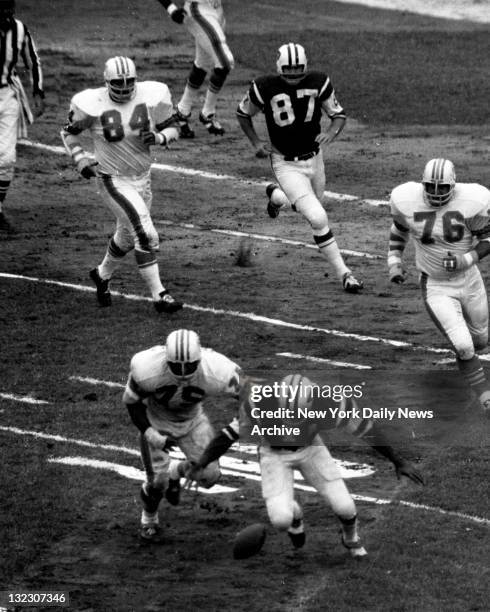 Football - N.Y. Jets vs Miami Dolphins In the first quarter, Jets' fullback Matt Snell fumbles a Joe Namath handoff as he's being chased by Dolphins'...