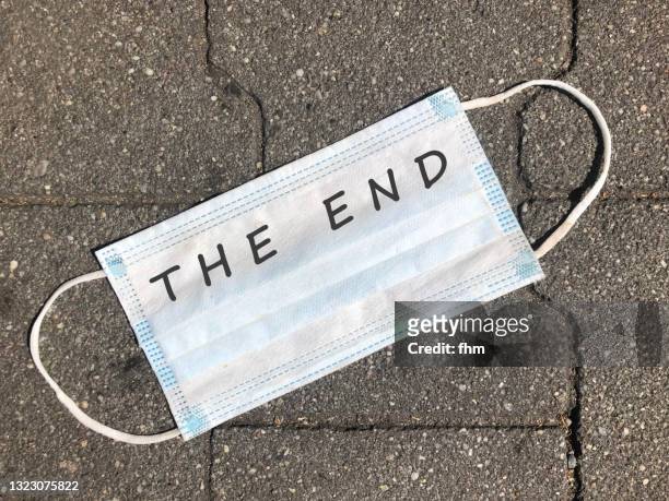 corona mask - the end - the end stock pictures, royalty-free photos & images