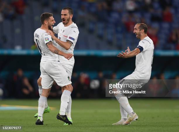 Domenico Berardi, Leonardo Bonucci and Giorgio Chiellini of Italy celebrate their side's first goal, an own goal scored by Merih Demiral of Turkey...