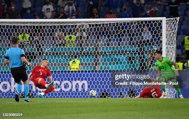 Merih Demiral of Turkey scores an own goal for Italy's first goal during the UEFA Euro 2020 Championship Group A match between Turkey and Italy at...