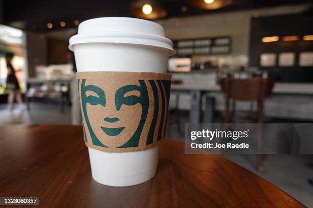 Starbucks coffee cup sits on a table as the company reported supply shortages at some coffee shops on June 11, 2021 in Miami, Florida. The coffee...