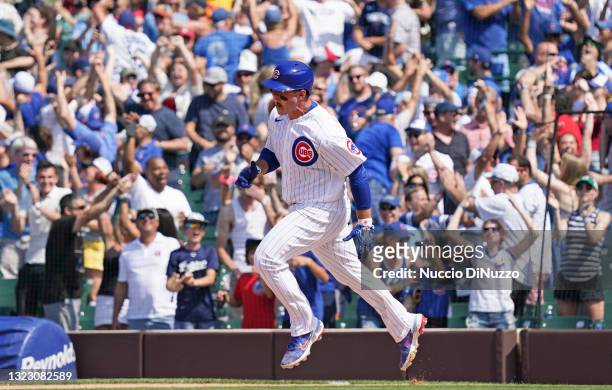 Anthony Rizzo of the Chicago Cubs celebrates his home run during the sixth inning of a game against the St. Louis Cardinals at Wrigley Field on June...