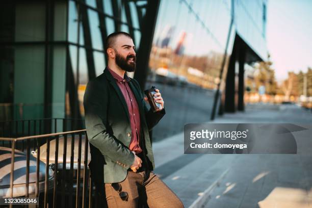 businessman drinking coffee during a coffee break - insulated drink container stock pictures, royalty-free photos & images