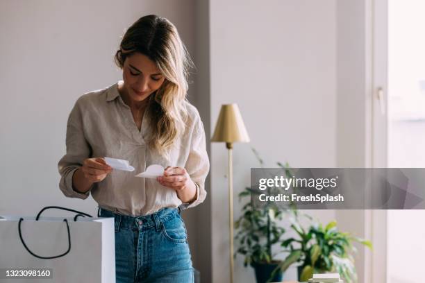 beautiful smiling woman holding thank you note - woman thank you letter stock pictures, royalty-free photos & images