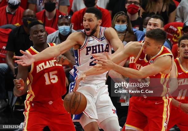 Ben Simmons of the Philadelphia 76ers battles for a rebound against Bogdan Bogdanovic of the Atlanta Hawks during the second half of game 3 of the...