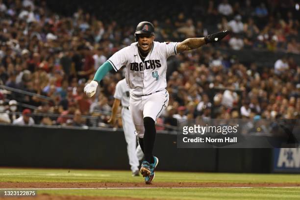 Ketel Marte of the Arizona Diamondbacks scores on a wild pitch by Shohei Ohtani of the Los Angeles Angels during the fifth inning at Chase Field on...