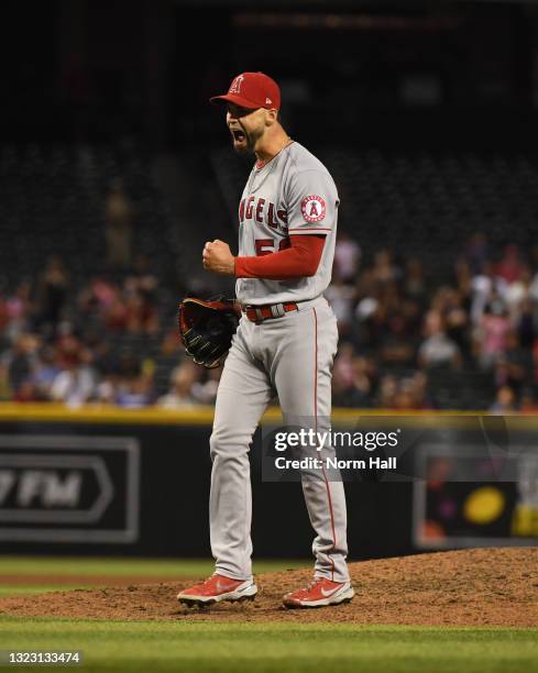 Alex Claudio of the Los Angeles Angels celebrates a 6-5 win against the Arizona Diamondbacks in ten innings at Chase Field on June 11, 2021 in...