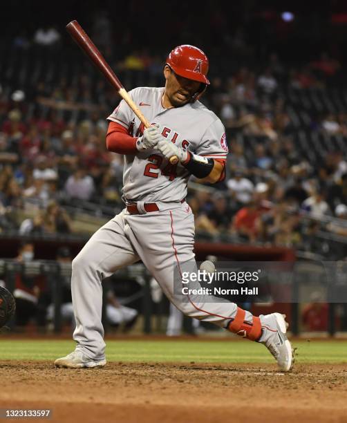 Kurt Suzuki of the Los Angeles Angels is hit by a pitch from Ryan Buchter of the Arizona Diamondbacks during the tenth inning at Chase Field on June...