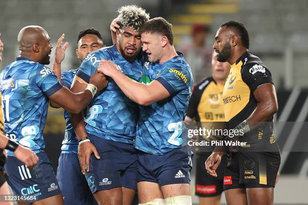 Hoskins Sotutu of the Blues celebrates his try with Dalton Papalii during the round five Super Rugby Trans-Tasman match between the Blues and the...