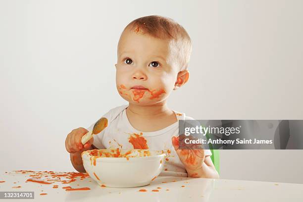 baby food boy - food stains stock pictures, royalty-free photos & images