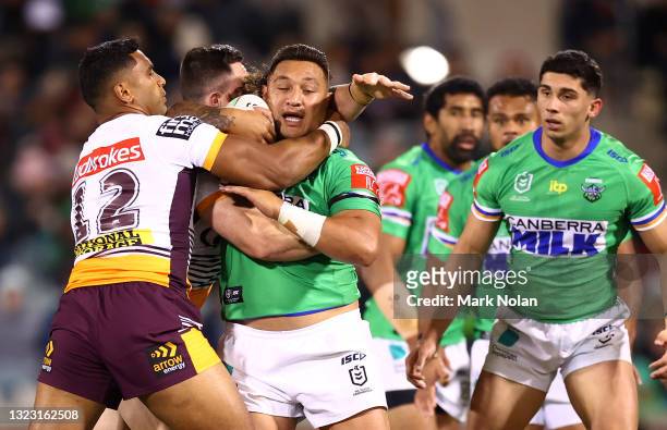 Josh Papalii of the Raiders is tackled during the round 14 NRL match between the Canberra Raiders and the Brisbane Broncos at GIO Stadium, on June 12...