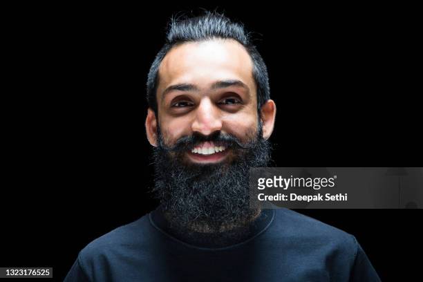 close up of bearded man:- stock photo - asian man long hair stock pictures, royalty-free photos & images