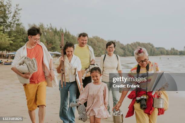 it's picnic time ... thai large family walking at the beach-stock photo - showus family stock pictures, royalty-free photos & images