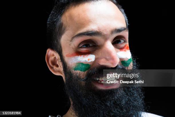 young men biggest fan of a cricket game:- stock photo - indian flag painted on face stock pictures, royalty-free photos & images
